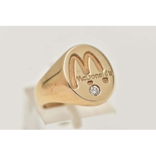 1 - A 9CT GOLD 'MCDONALDS' SIGNET RING, a yellow gold oval signet, signed 'McDonalds', flush set with a ... 