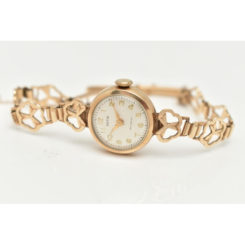 26 - A LADIES 9CT GOLD WRISTWATCH, manual wind, round silver dial signed 'Hefix', Arabic numerals, gold t... 