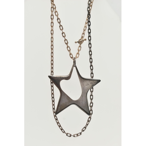 36 - A GEORG JENSEN SILVER STAR PENDANT, an abstract star designed by 'Henning Koppel', approximate width... 