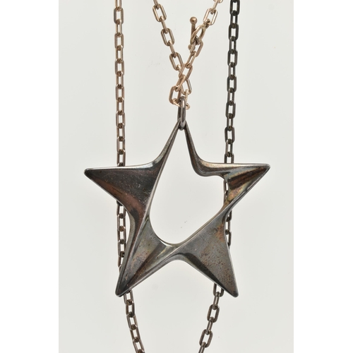 36 - A GEORG JENSEN SILVER STAR PENDANT, an abstract star designed by 'Henning Koppel', approximate width... 