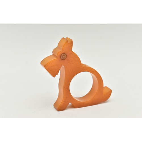 48 - A BAKELITE NAPKIN RING, designed as a butterscotch scotty dog, approximate height 73mm, approximate ... 