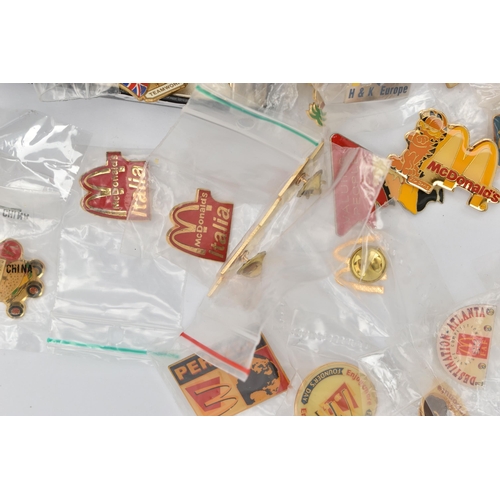 65 - AN ASSORTMENT OF 'MCDONALDS' ITEMS, to include a ladies quartz wristwatch with McDonalds 'M' logo, t... 