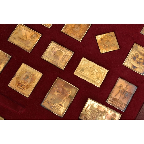 94 - CASED 'THE EMPIRE COLLECTION' GOLD PLATED SILVER REPLICAS, containing twenty five silver gilt stamps... 