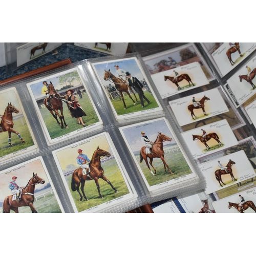 331 - A Wicker Picnic Hamper with a few utensils, five framed sets of Cigarette Cards on a Horse Racing th... 