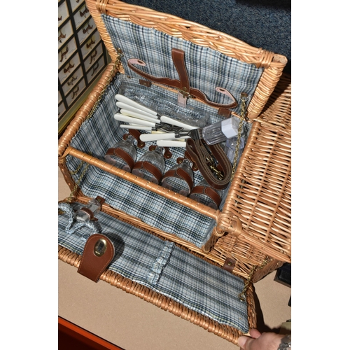 331 - A Wicker Picnic Hamper with a few utensils, five framed sets of Cigarette Cards on a Horse Racing th... 