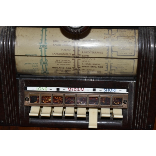 336 - A PILOT T63 AC SUPERHET WIRELESS RADIO, with original service sheet and receipt for service dated 20... 