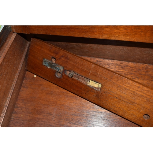 374 - A LARGE WRITING SLOPE, with brass banding, escutcheon, vacant cartouche and flush handles, the inter... 