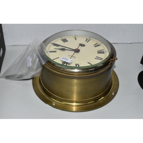 376 - A BRASS CASED SMITH ASTRAL BULKHEAD CLOCK, the cream dial with black Roman numerals, diameter includ... 