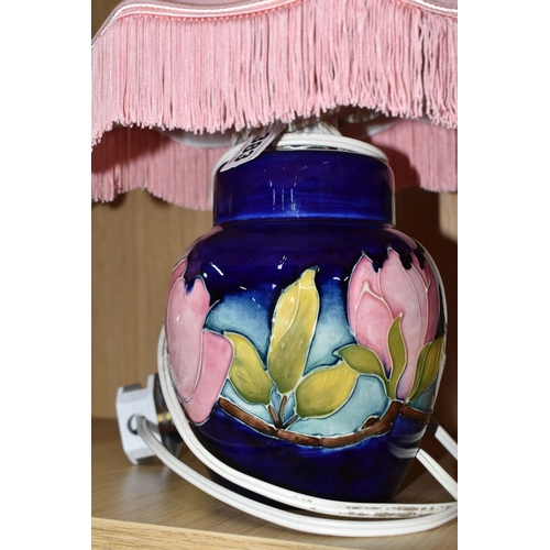 383 - A PAIR OF MOORCROFT POTTERY CONVERTED GINGER JAR TABLE LAMPS, tube lined in the Magnolia pattern on ... 