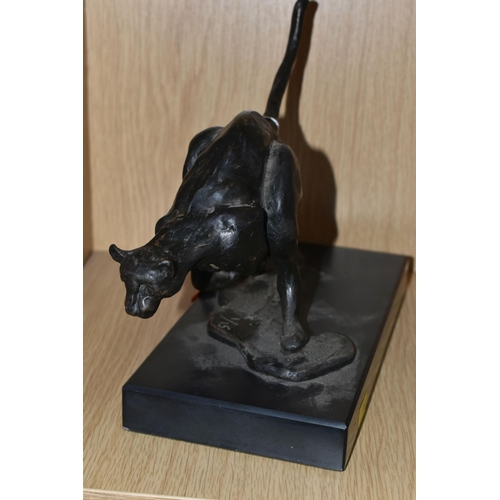 384 - A BRONZED RESIN FIGURE OF A RUNNING CHEETAH, supported by a black marble base, length 25cm x 11.5cm ... 