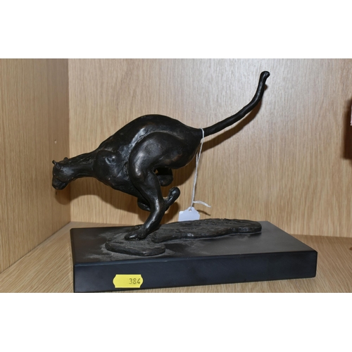 384 - A BRONZED RESIN FIGURE OF A RUNNING CHEETAH, supported by a black marble base, length 25cm x 11.5cm ... 