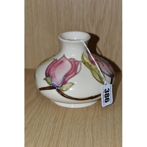 386 - A MOORCROFT POTTERY 'MAGNOLIA' PATTERN VASE, of squat bulbous form, tube lined with pink Magnolia fl... 