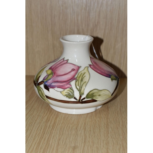 386 - A MOORCROFT POTTERY 'MAGNOLIA' PATTERN VASE, of squat bulbous form, tube lined with pink Magnolia fl... 