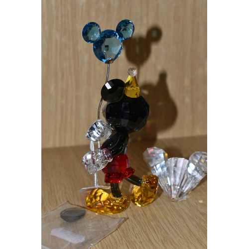 405 - A SWAROVSKI CRYSTAL 'MICKEY MOUSE - CELEBRATION' FIGURE, depicts Mickey in a party hat, holding a ba... 