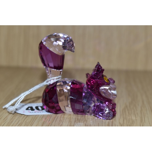 407 - A SWAROVSKI CRYSTAL 'CHESHIRE CAT' FIGURE, from Disney's Alice in Wonderland, produced in 2016-2018,... 