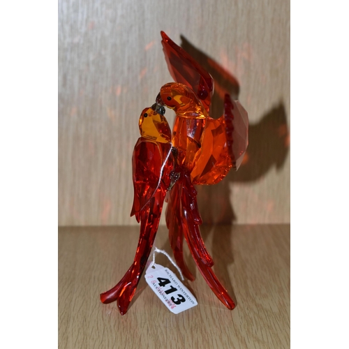 413 - A SWAROVSKI CRYSTAL PARADISE BIRDS 'RED PARROTS' SCULPTURE, model no 5136809, depicting a pair of pa... 