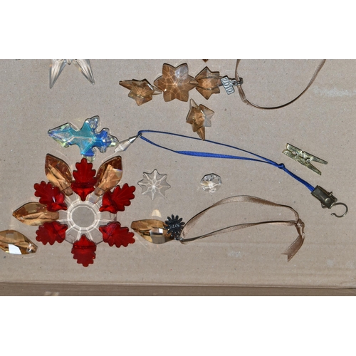 422 - A BOX OF SWAROVSKI CRYSTAL CHRISTMAS ORNAMENTS, comprising a tree topper, 2009 Gold SCS, 2009 Little... 