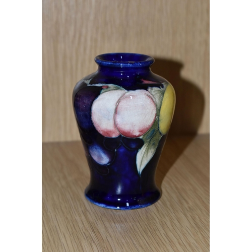 428 - A MOORCROFT POTTERY SMALL 'WISTERIA' PATTERN VASE, of baluster form, tube lined with red, purple and... 