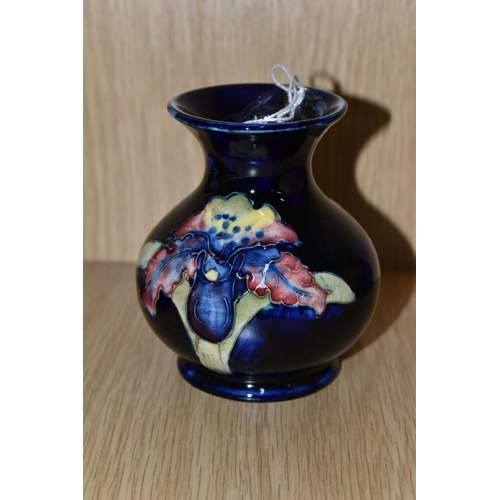 429 - A MOORCROFT POTTERY SMALL 'ORCHID' PATTERN VASE, of baluster form, tube lined with red, purple, blue... 