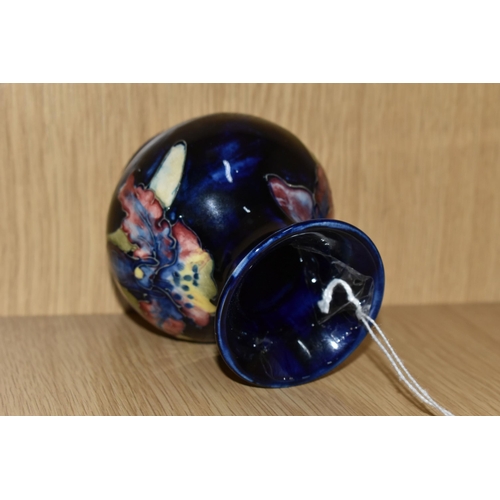 429 - A MOORCROFT POTTERY SMALL 'ORCHID' PATTERN VASE, of baluster form, tube lined with red, purple, blue... 