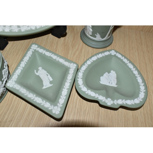 432 - FIVE PIECES OF SAGE GREEN WEDGWOOD JASPERWARE, comprising a covered pot, an oval tray, a vase height... 