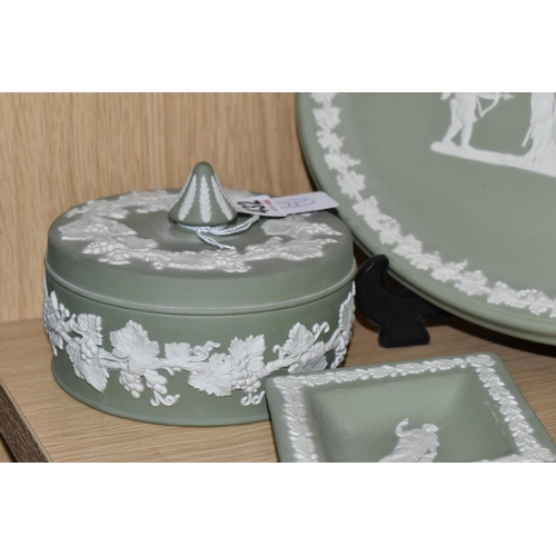 432 - FIVE PIECES OF SAGE GREEN WEDGWOOD JASPERWARE, comprising a covered pot, an oval tray, a vase height... 