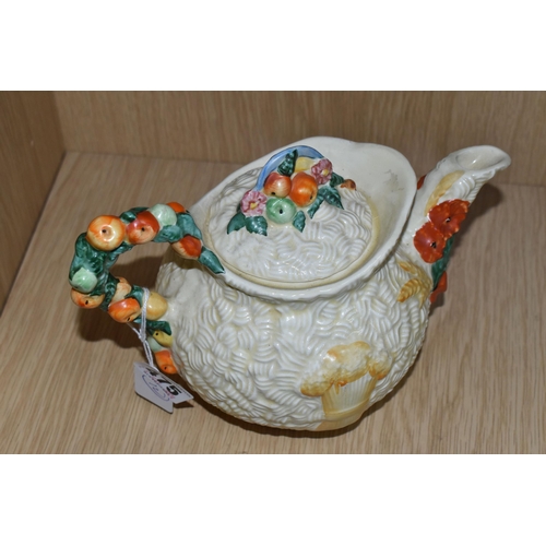 475 - A CLARICE CLIFF 'CELTIC HARVEST' TEAPOT, moulded and painted with fruits and wheatsheaves on a textu... 