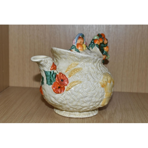 475 - A CLARICE CLIFF 'CELTIC HARVEST' TEAPOT, moulded and painted with fruits and wheatsheaves on a textu... 