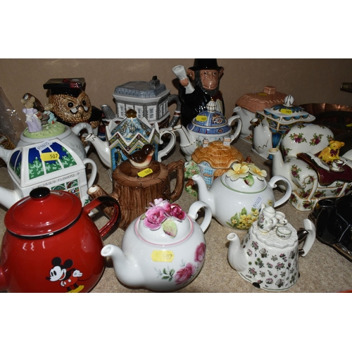 507 - A COLLECTION OF SEVENTEEN NOVELTY CERAMIC TEA POTS, including a Price Kensington Potteries black tax... 