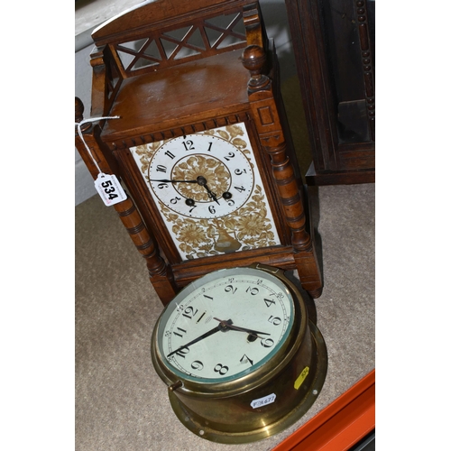 534 - THREE VINTAGE CLOCKS to include a 'Tempora' brass bulkhead clock from the early 20th century, a  wal... 