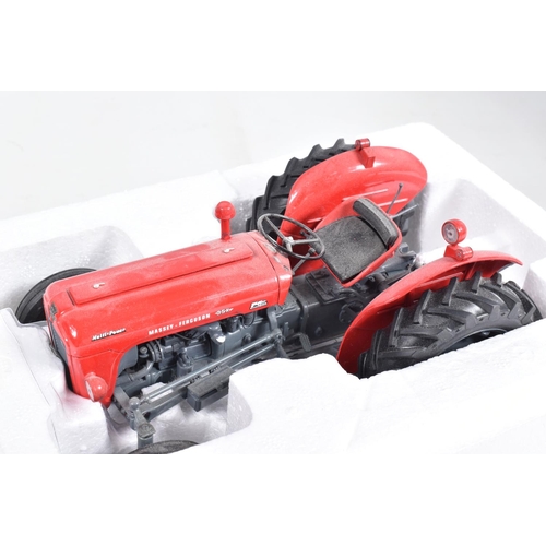 46 - A BOXED UNIVERSAL HOBBIES MASSEY FERGUSSON MF 35X 1:16 SCALE MODEL, numbered UH2692, red body with g... 