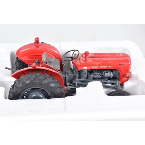 46 - A BOXED UNIVERSAL HOBBIES MASSEY FERGUSSON MF 35X 1:16 SCALE MODEL, numbered UH2692, red body with g... 