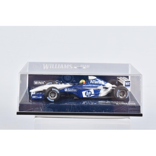 53 - FOUR BOXED MINICHAMPS RACING VEHICLES, to include a McLaren Mercedes MP4-19 D.Coulthard, edition 43 ... 