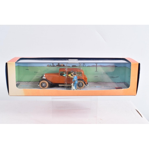 73 - FOUR BOXED HERGE MOULINSART EN VOITURE TINTIN MODELS, to include a Album Les Cigares du Pharaon L'av... 