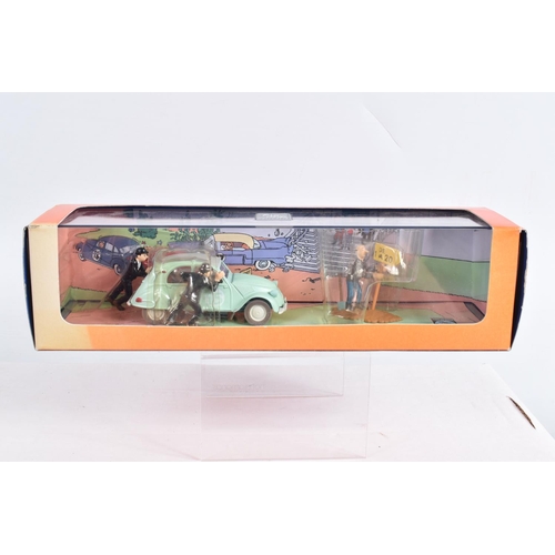 73 - FOUR BOXED HERGE MOULINSART EN VOITURE TINTIN MODELS, to include a Album Les Cigares du Pharaon L'av... 