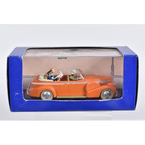 76 - SIX BOXED EN VOITURE TINTIN MODEL VEHICLES, the first is a Le Taxi De Tintin En Amerique, numbered 2... 