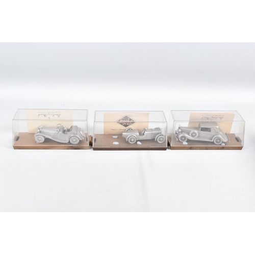 79 - A COLLECTION OF DANBURY MINT WHITE METAL MODEL CARS IN DISPLAY CASES, to include, each with its own ... 