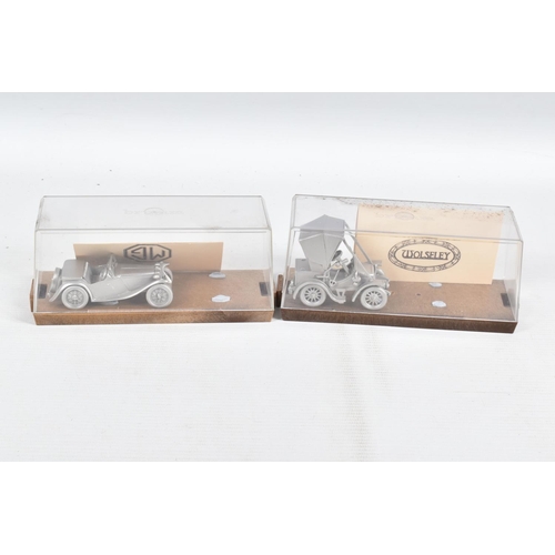 79 - A COLLECTION OF DANBURY MINT WHITE METAL MODEL CARS IN DISPLAY CASES, to include, each with its own ... 