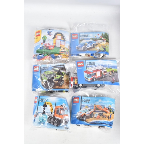 99 - A COLLECTION OF TWELVE UNBUILT LEGO SETS, to include a 60117 City Van & Caravan, a 60074 City Bulldo... 