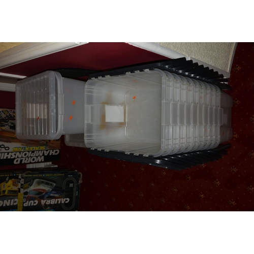 111 - A QUANTITY OF EMPTY CLEAR PLASTIC LARGE STORAGE BOXES, three with lids, eleven boxes with attached h... 