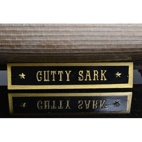 112 - A CONSTRUCTED REVELL PLASTIC KIT OF THE CUTTY SARK HOUSED IN A PERSPEX DISPLAY CASE, kit has been co... 