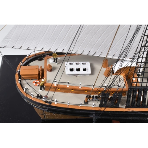 112 - A CONSTRUCTED REVELL PLASTIC KIT OF THE CUTTY SARK HOUSED IN A PERSPEX DISPLAY CASE, kit has been co... 