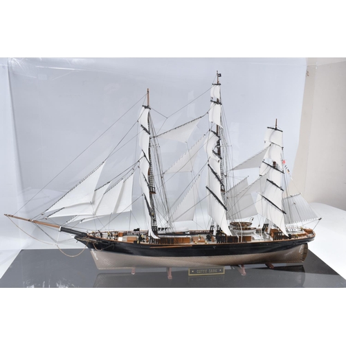 112 - A CONSTRUCTED REVELL PLASTIC KIT OF THE CUTTY SARK HOUSED IN A PERSPEX DISPLAY CASE, kit has been co... 