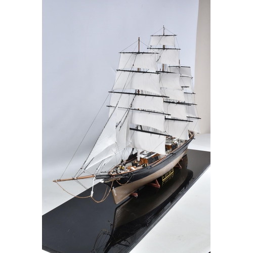 112 - A CONSTRUCTED REVELL PLASTIC KIT OF THE CUTTY SARK HOUSED IN A PERSPEX DISPLAY CASE, kit has been co... 