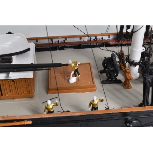 112 - A CONSTRUCTED REVELL PLASTIC KIT OF THE CUTTY SARK HOUSED IN A PERSPEX DISPLAY CASE, kit has been co... 