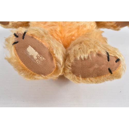 113 - A GOLDEN PLUSH TEDDY BEAR, amber and black plastic eyes, vertically stitched nose, jointed body, ori... 