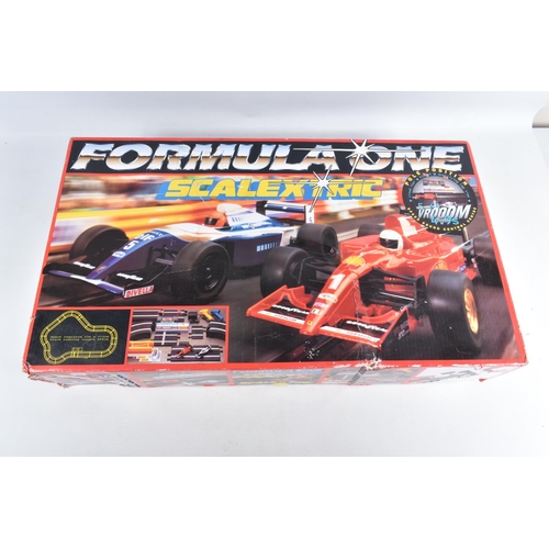 145 - THREE BOXED HORNBY SCALEXTRIC SETS, to include a Formula One C1007 set, appears largely complete wit... 