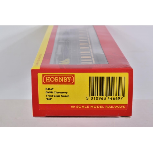 336 - SIX BOXED 00 SCALE HORNBY MODELS AND A BLISTER PACK OF 00 SCALE CONTAINERS, to include a GWR Autocoa... 