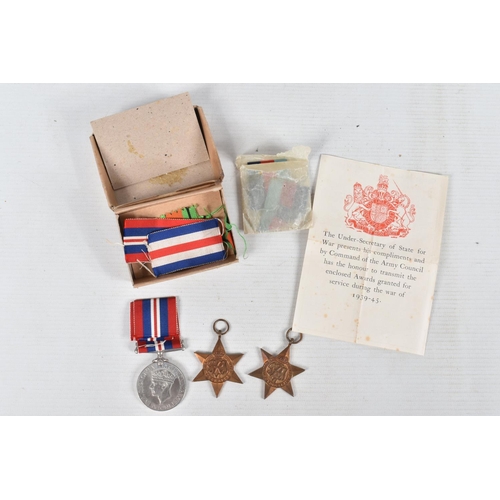 362 - A WOODEN BOX CONTAINING TWO SETS OF WWII MEDALS, cap badges, formation patches and other military ep... 