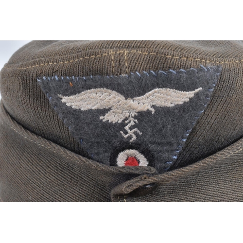 364 - TWO WWII ERA STYLE GARMAN ARMY HATS, the first is a field cap with Luftwaffe insignia to the front a... 